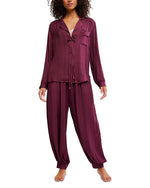 Free People Let's Sleep In Set in deep burgundy, model wearing button-front long-sleeve top with ruffle trim and matching jogger pants, front view.