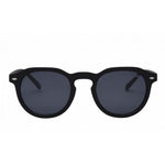 I SEA Blair sunglasses in matte black with round smoke polarized lenses and silver hinge accents, front view