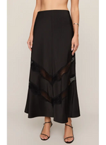 Z SUPPLY Kori Lace Inset Skirt in black, featuring chevron sheer mesh and lace panels, midi length, worn by model with strappy heels