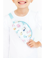 Mila Puppy Pals Belt Bag worn crossbody by a child — white bag with colorful cartoon dogs and teal zipper trim