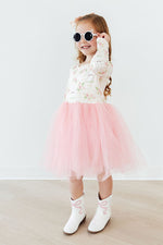 Mila Spring Kittens L/S Tutu Dress in pink tulle with floral kitten print bodice, worn by girl with cat sunglasses and white cowboy boots