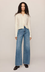 Z SUPPLY Medina Pointelle Cardigan in Cloud, a cream button-front knit with pointelle texture, worn by model with wide-leg jeans, front view.