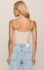 Z SUPPLY Luxe Smooth Essential Tank in Frosted Pearl, back view on model styled with light wash jeans, adjustable straps visible