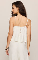 Z SUPPLY Lille Embroidered Woven Tank in white, back view on model, showing lace trim, tie-back detail, and thin adjustable straps