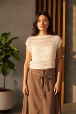 Sadie and Sage Adara Open Knit Sweater Vest in cream worn by model with brown maxi skirt, front view showing open-weave texture