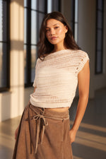 Sadie and Sage Adara Open Knit Sweater Vest in cream, worn by model with brown maxi skirt, front view showing open-weave texture