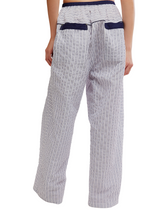 Free People Cross My Heart Lounge Pant in Ivory Combo, back view on model, navy pinstripe seersucker fabric with navy elastic waistband and back pockets.