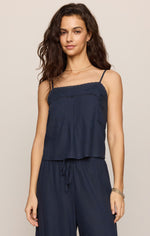 Z Supply Lille Embroidered Woven Tank in Eclipse navy, featuring spaghetti straps and crochet trim detail, worn by model with matching wide-leg pants.