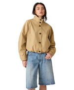Steve Madden Fayden Jacket in khaki tan, front view on model, cropped silhouette with mock neck, dark buttons, and wide sleeves