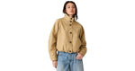Steve Madden Fayden Jacket in tan/khaki with button front, mock neck, balloon sleeves, and elastic hem, worn with wide-leg jeans