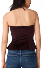 Steve Madden Dawnette Top in Deep Fig — back view of strapless velvet peplum corset top on model with matching trousers