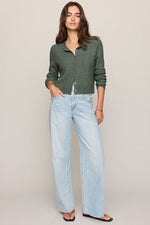 Z SUPPLY Medina Pointelle Cardigan in Monstera green, cable-knit button-front cropped style, worn by model with wide-leg light wash jeans