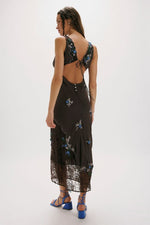 Free People Meet Again Midi dress in black with blue floral embroidery, back view showing open back detail and lace hem