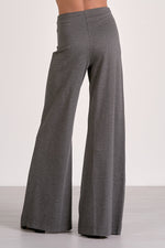 Elan Wide Leg Pants in dark grey heather, back view on model, showing flared silhouette and wide waistband