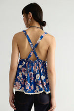 Free People Rome Printed Tank in Navy Combo, back view on model showing criss-cross straps, open back, floral print, and lace hem.