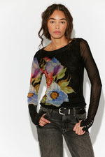 Free People Lilly Printed Longsleeve in Black Combo — sheer mesh top with bold watercolor floral graphic, front view on model