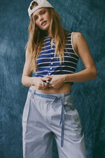 Free People Tilly Striped Tank in Navy Combo — navy and white horizontal stripes, button-front, sleeveless crop top worn by model