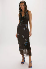 Free People Meet Again Midi dress in dark brown with blue floral embroidery, lace trim, and sheer hem worn by model