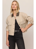 Z SUPPLY Rey Cropped Chore Jacket in Soapstone, front view on model, featuring dark contrast collar, snap buttons, and chest flap pockets