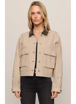 Z SUPPLY Rey Cropped Chore Jacket in Soapstone, front view on model, featuring dark leather collar, cargo pockets, and button front