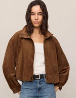Z SUPPLY Corin Bubble Hem Jacket in Saddle Suede brown, worn open over white tank with jeans, front view on model