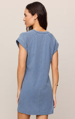 Z SUPPLY Tate Jersey Denim Mini Dress in Santorini Indigo, back view on model showing seam detail and cap sleeves